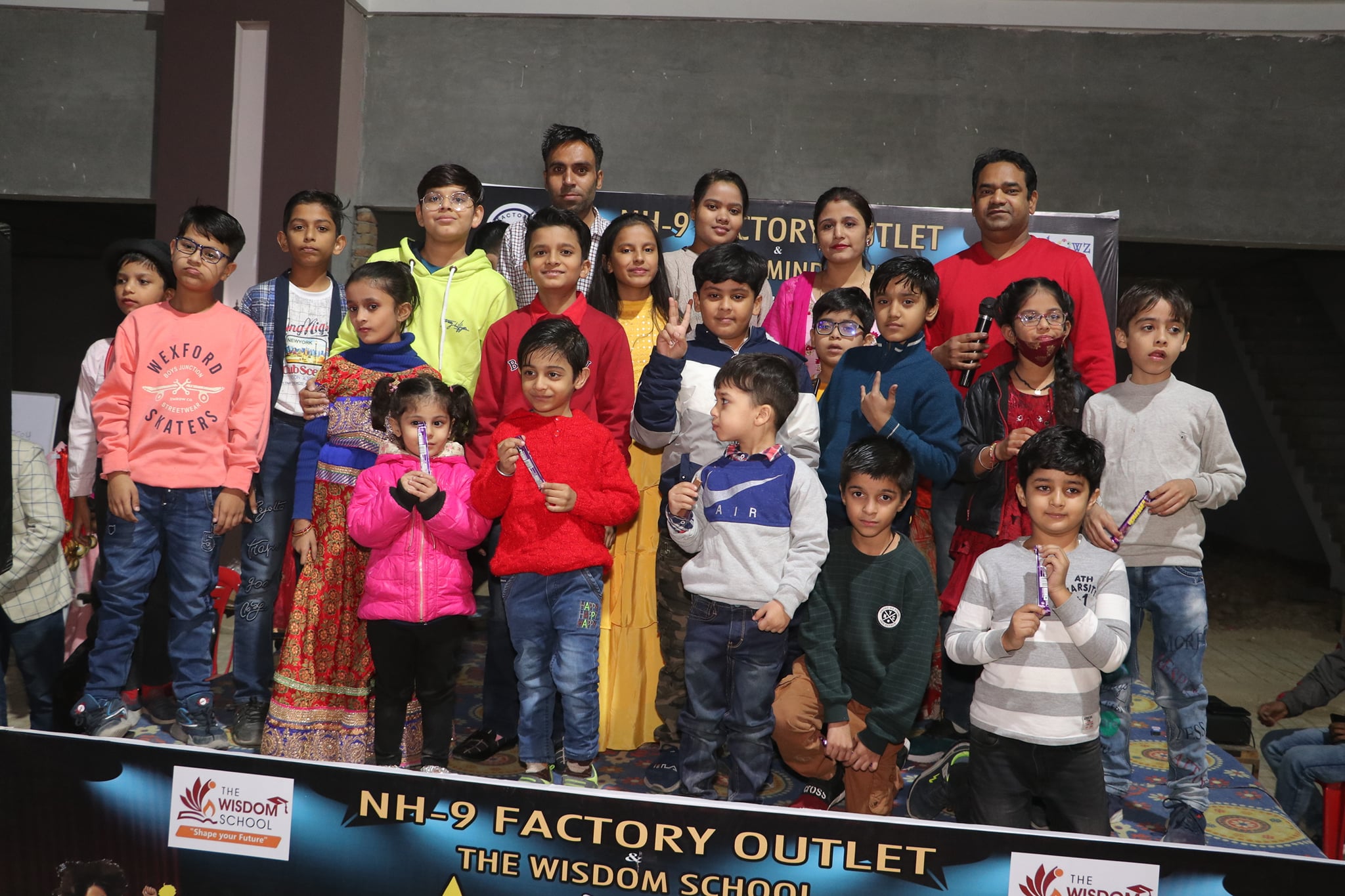 Students from Rainbowz Mind Studio posing during NH9 Sirsa event